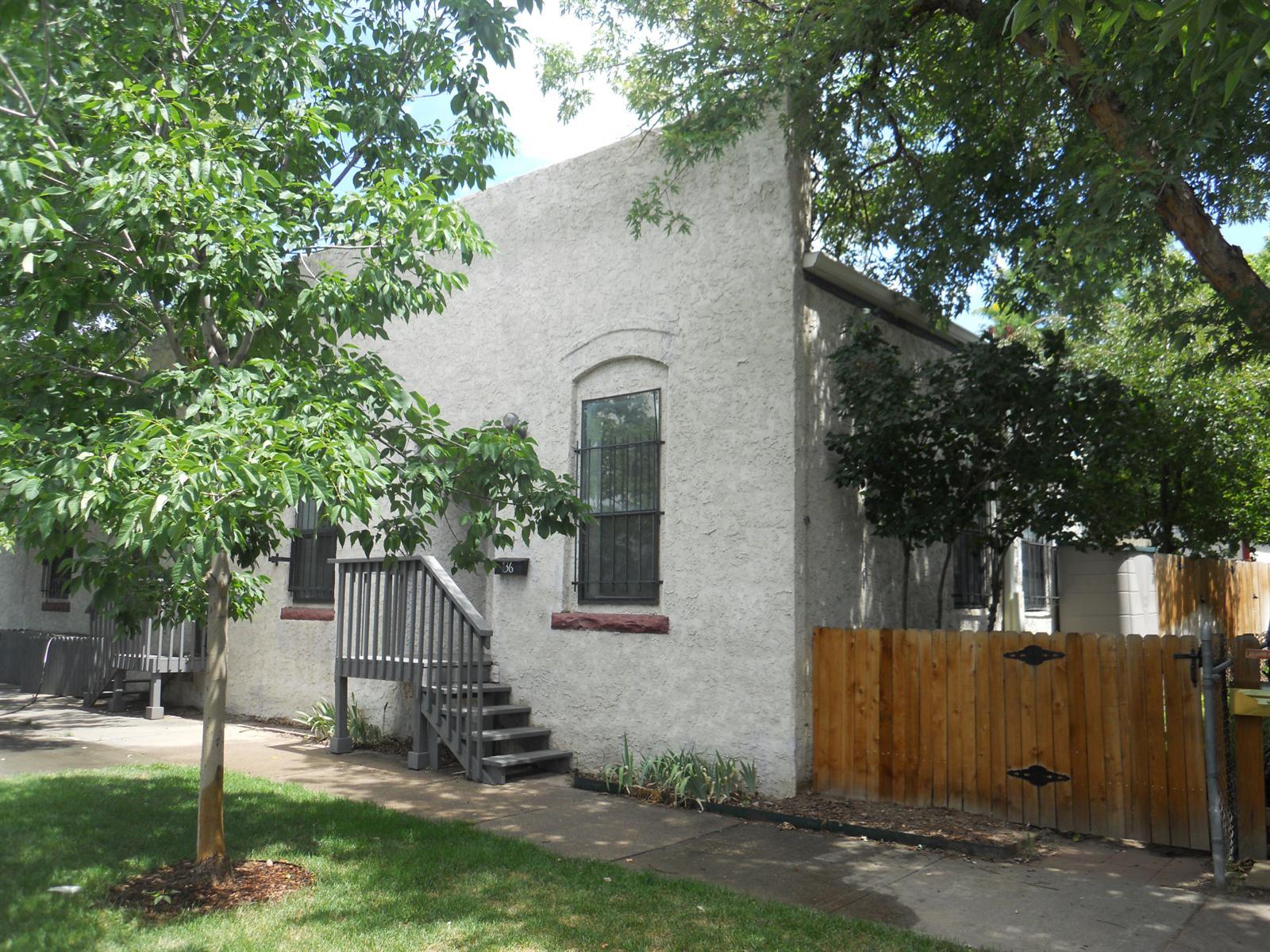 136 Inca Street Denver, CO 80223 - Photo 1 of 1 a view of a house with a yard