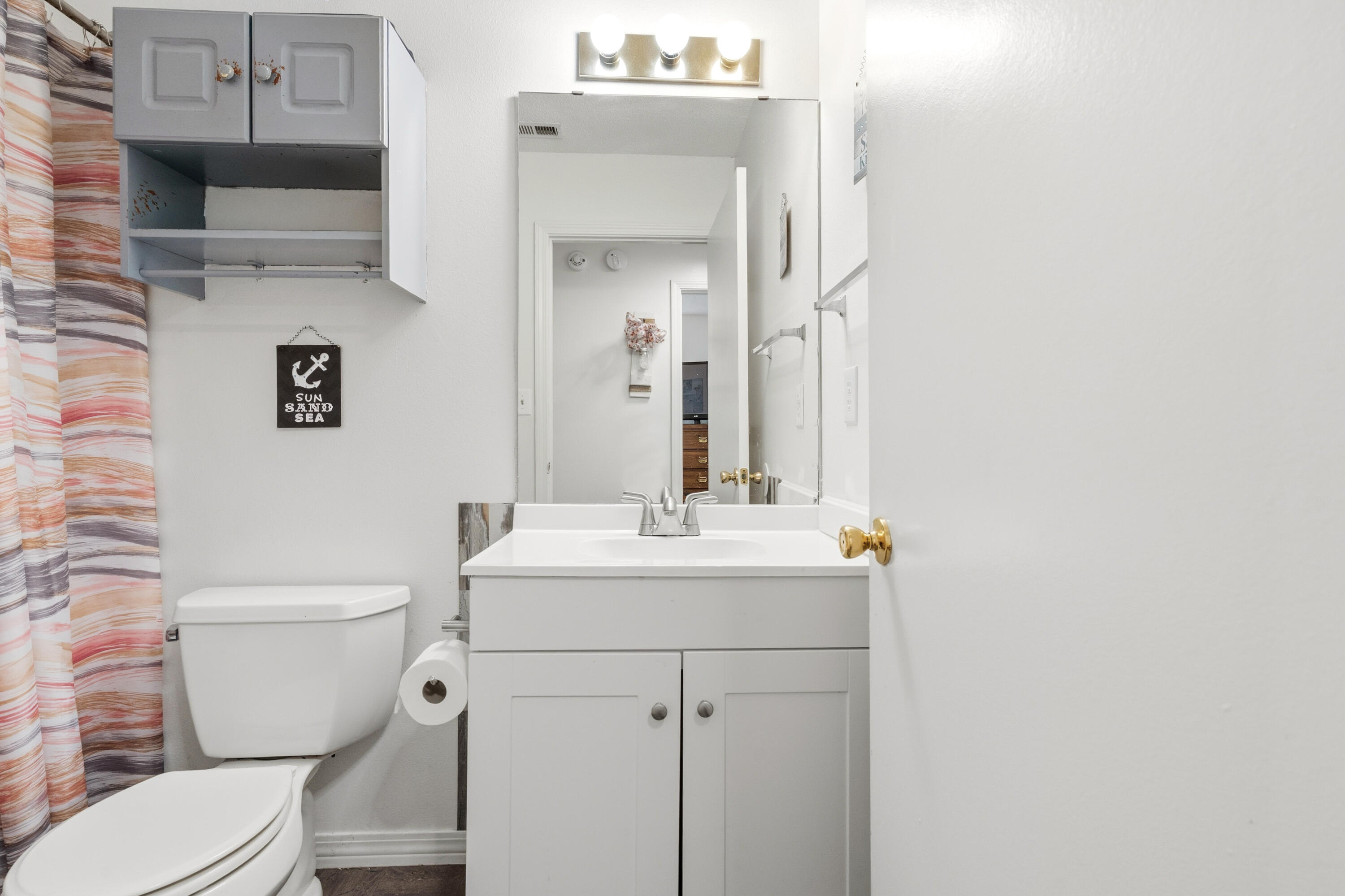 2880 Aplin Road Crestview, FL 32539 - Photo 23 of 33 a bathroom with a sink a toilet and a mirror