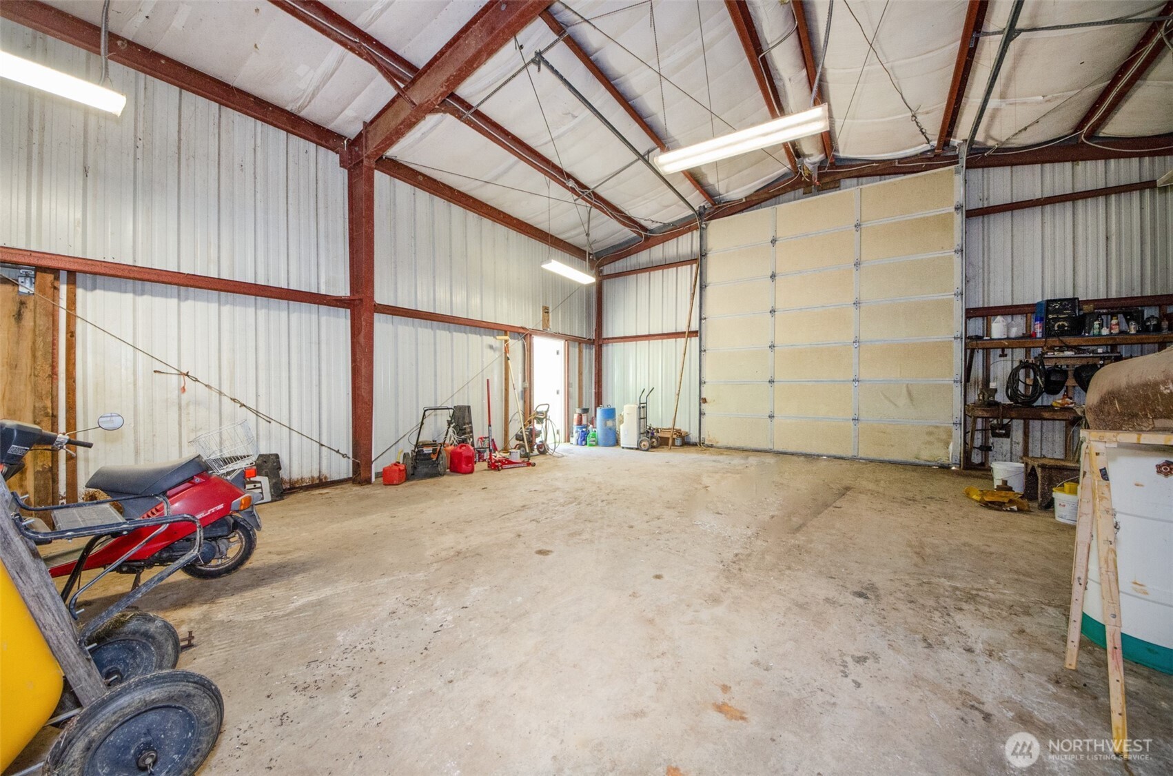 12832 Hunter Road Southwest Rochester, WA 98579 - Photo 19 of 40 a view of a garage with rack and bicycle