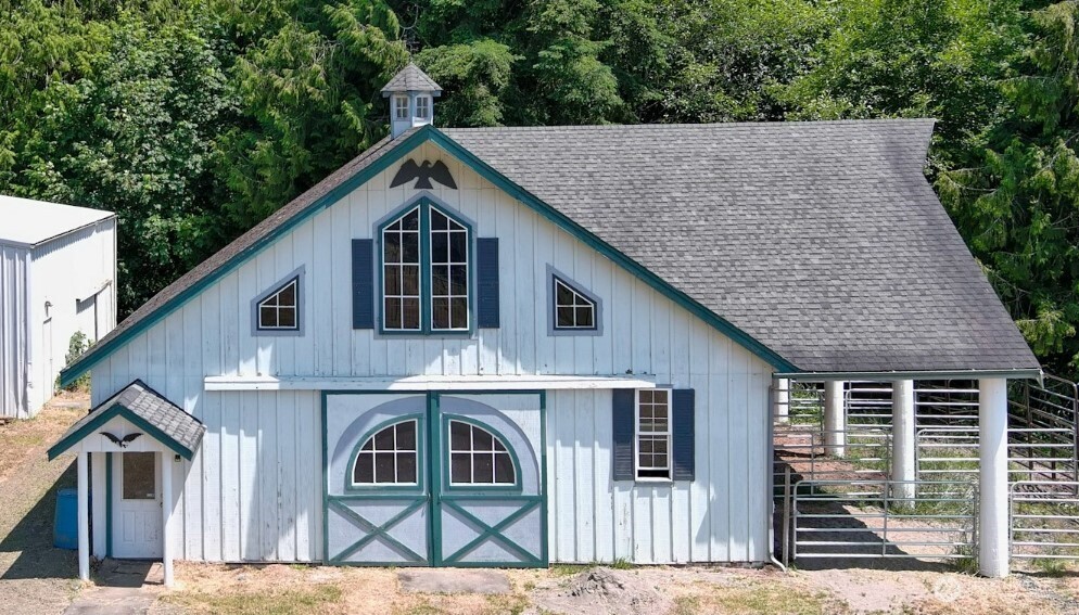12832 Hunter Road Southwest Rochester, WA 98579 - Photo 21 of 40 a front view of a house with a garden