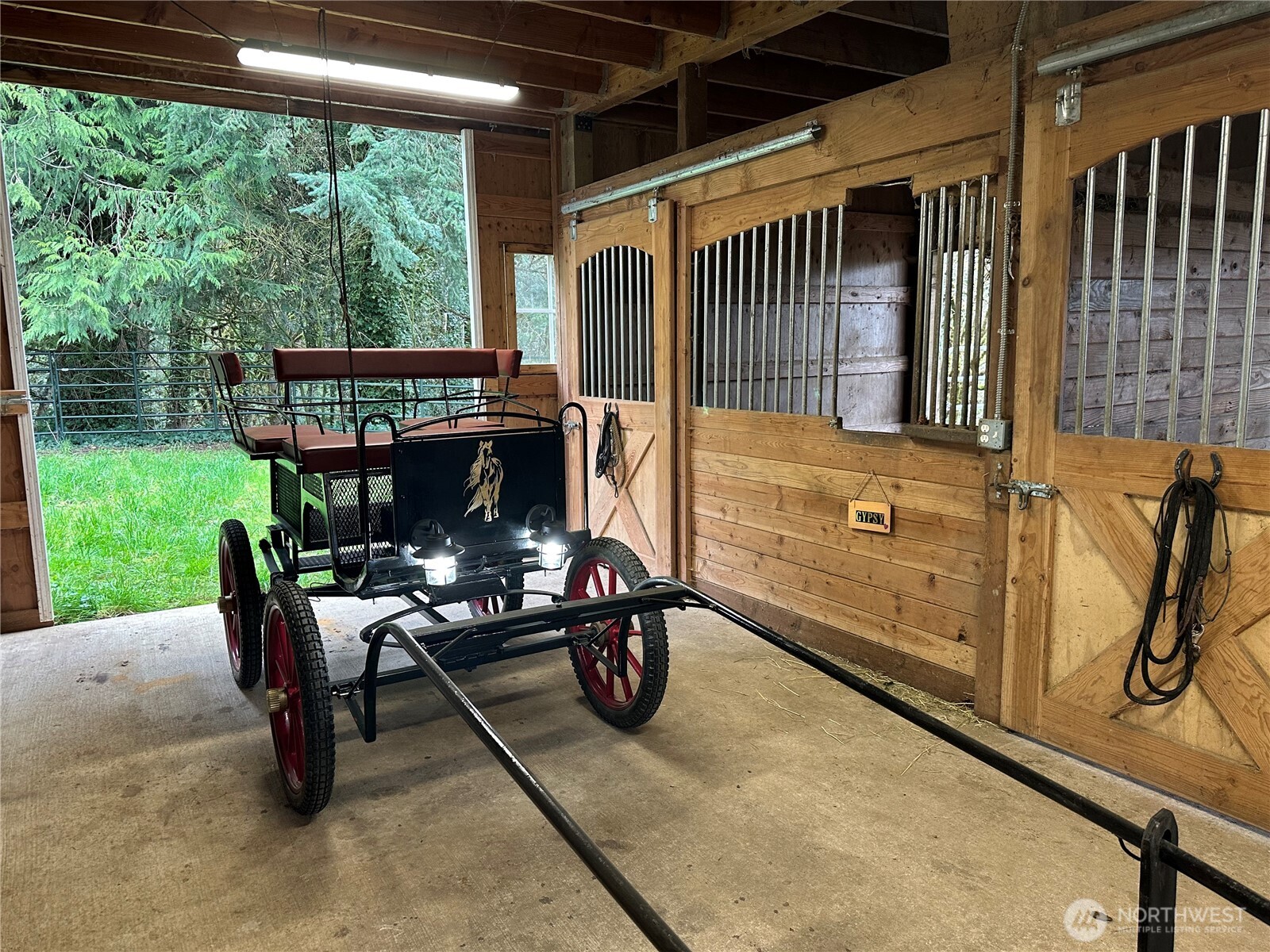 12832 Hunter Road Southwest Rochester, WA 98579 - Photo 22 of 40 a view of a patio with a table chairs and a yard