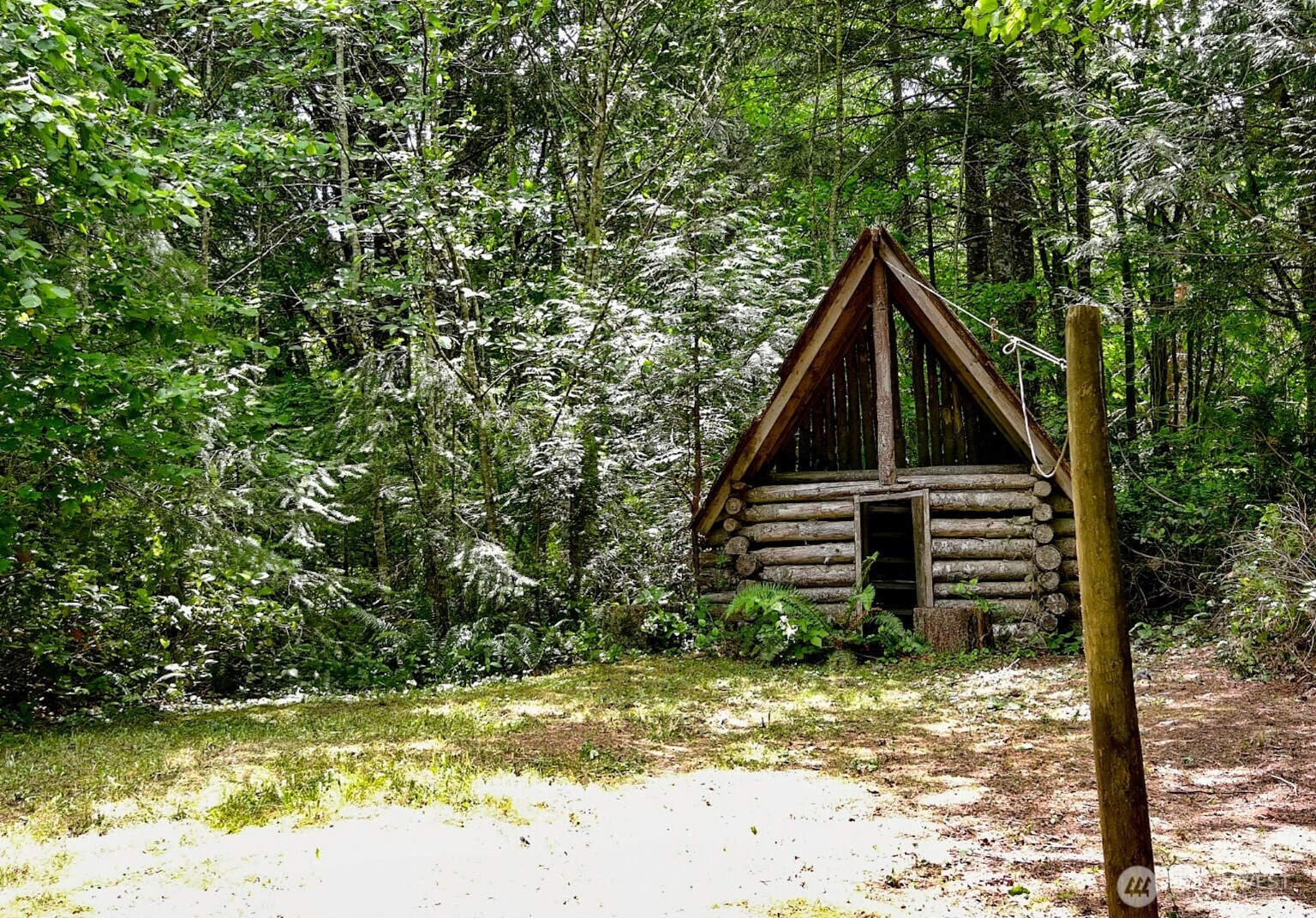 12832 Hunter Road Southwest Rochester, WA 98579 - Photo 30 of 40 a front view of a house with a yard