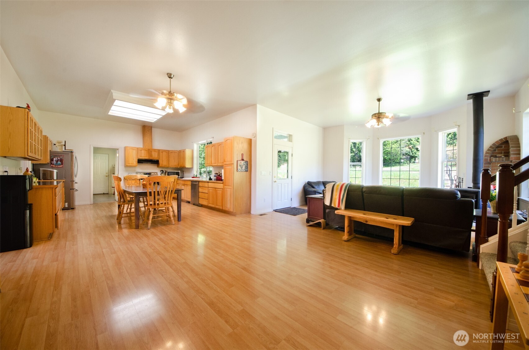 12832 Hunter Road Southwest Rochester, WA 98579 - Photo 7 of 40 a living room with furniture and wooden floor