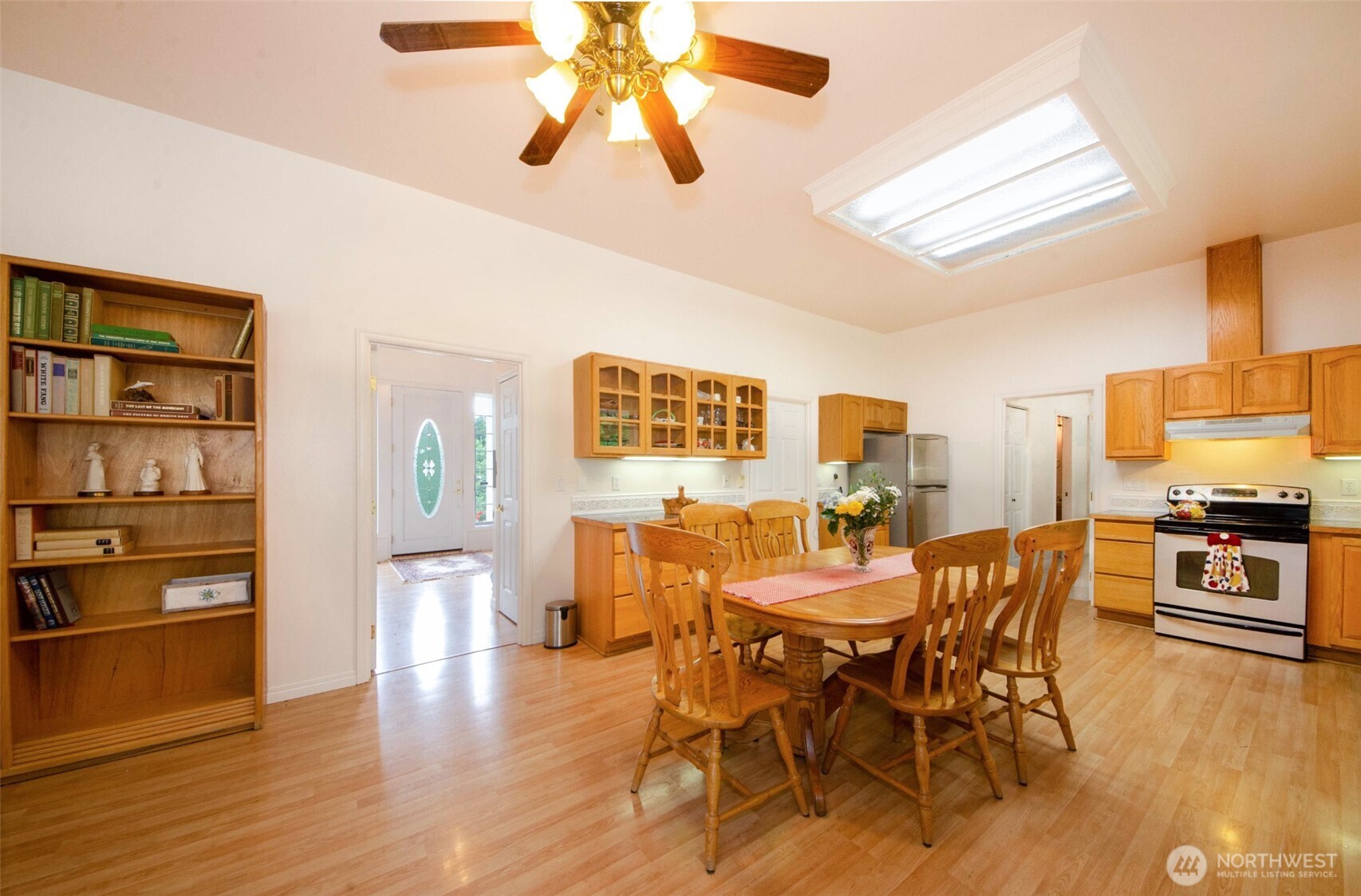 12832 Hunter Road Southwest Rochester, WA 98579 - Photo 9 of 40 a view of a dining room with furniture and wooden floor