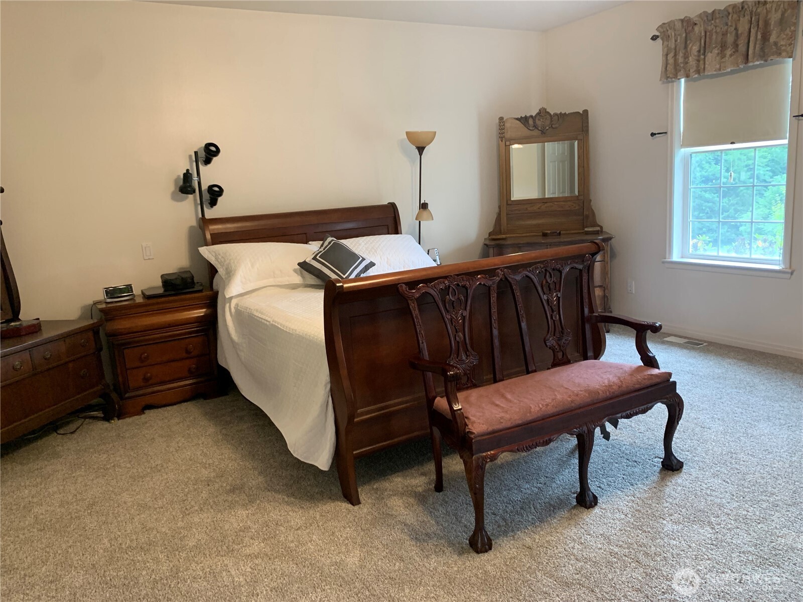 12832 Hunter Road Southwest Rochester, WA 98579 - Photo 10 of 40 a bedroom with furniture and a window