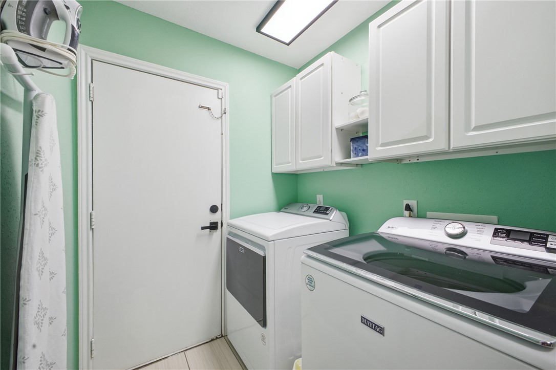 1702 Ibis Court Bryan, TX 77807 - Photo 12 of 18 a utility room with dryer and washer