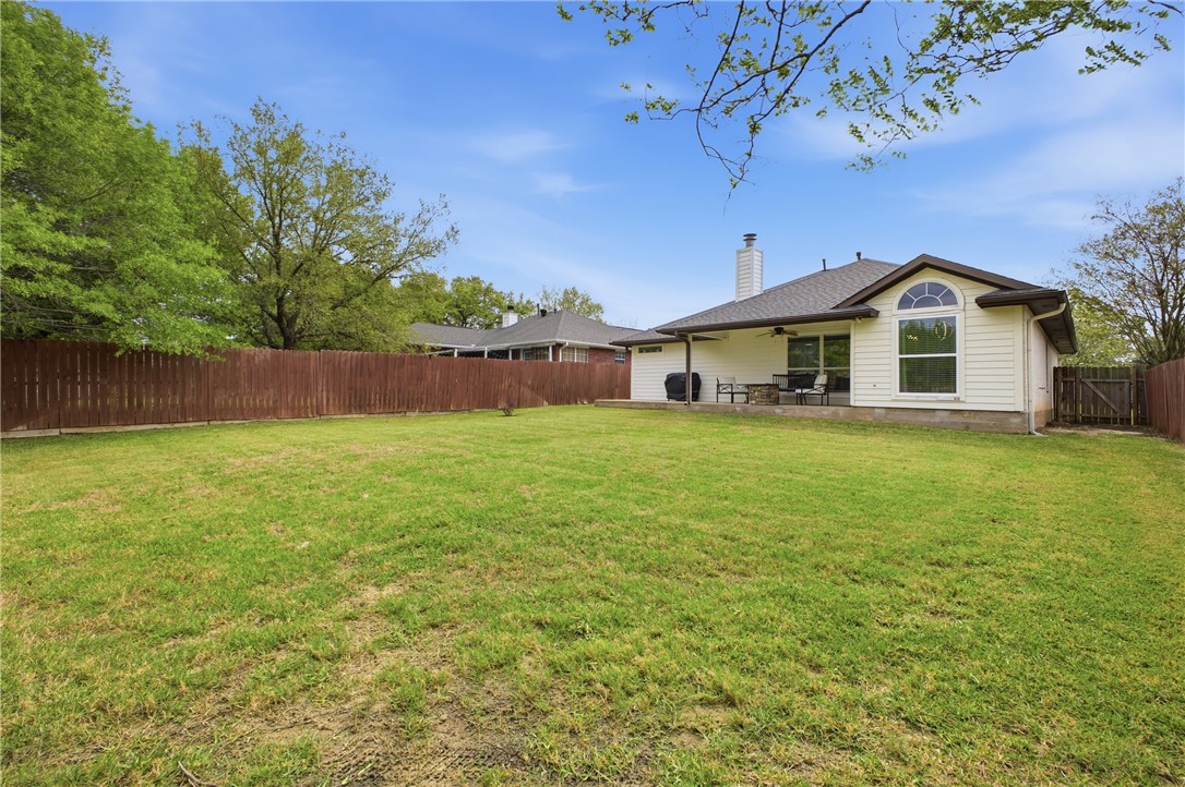 1702 Ibis Court Bryan, TX 77807 - Photo 18 of 18 a front view of a house with a yard