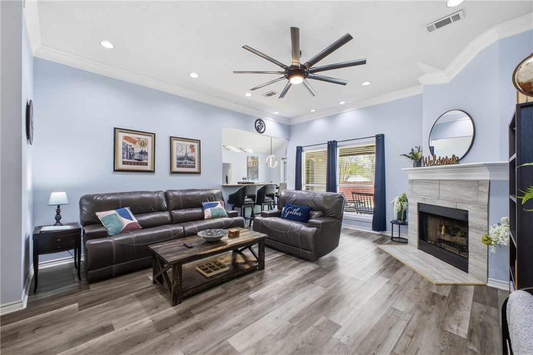 1702 Ibis Court Bryan, TX 77807 - Photo 4 of 18 a living room with furniture a window and a fireplace