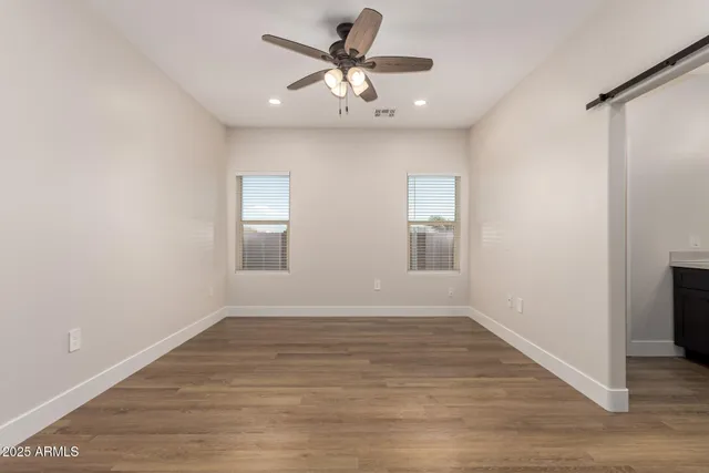 wooden floor and window in an empty room