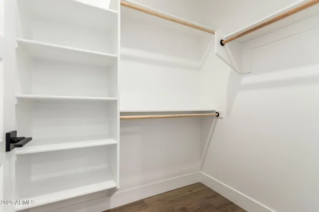 a view of an empty walk in closet