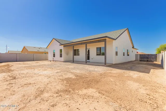 a view of a house with snow on the road