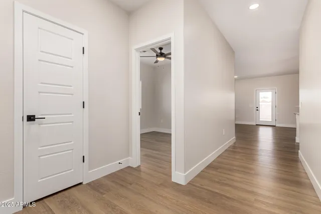 wooden floor with white walls