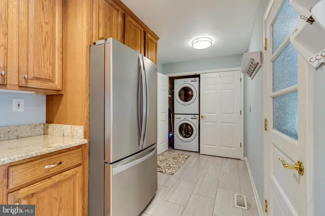 a view of a storage and utility room with washer and dryer