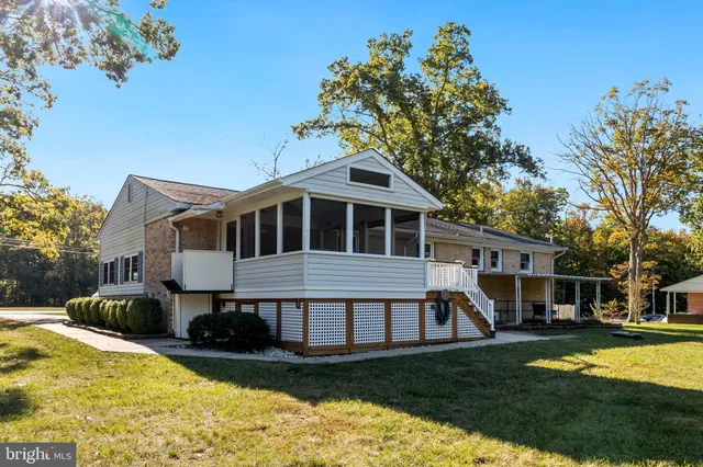 a front view of a house with a yard table and chairs