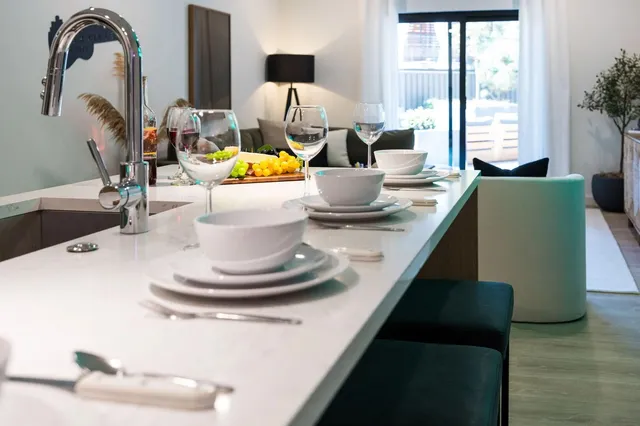 a living room with furniture and a mirror