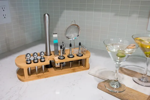 a bedroom with a bed and painting on the wall