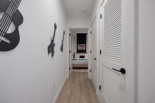 a lobby with furniture and potted plants