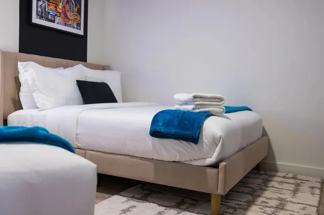 a view of a room with a table and chairs