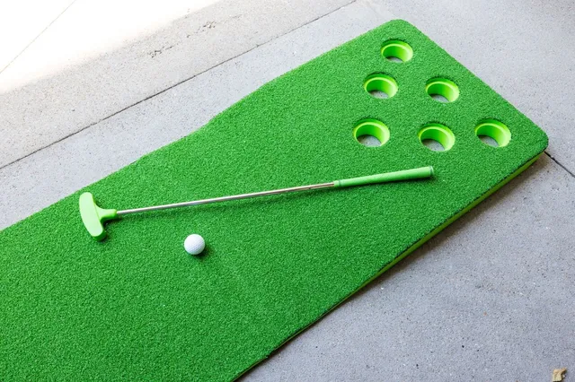 a view of a swimming pool with outdoor seating