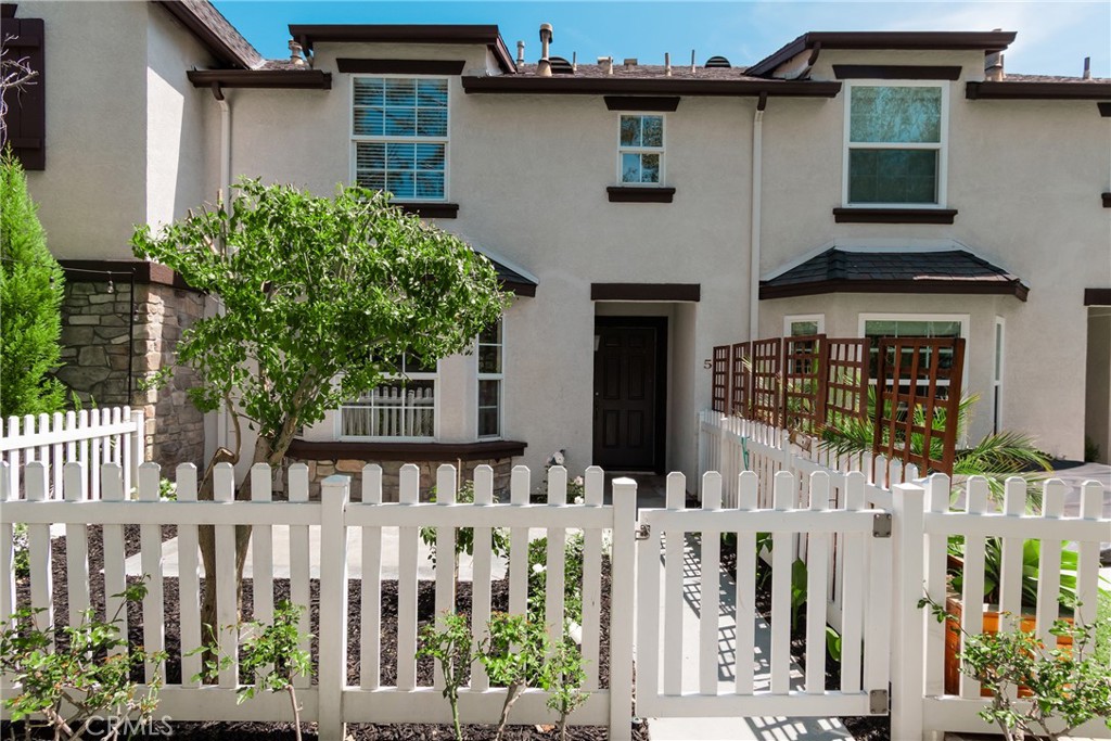 5 Three Vines Court Ladera Ranch, CA 92694 - Photo 1 of 50 a front view of white house with a small yard