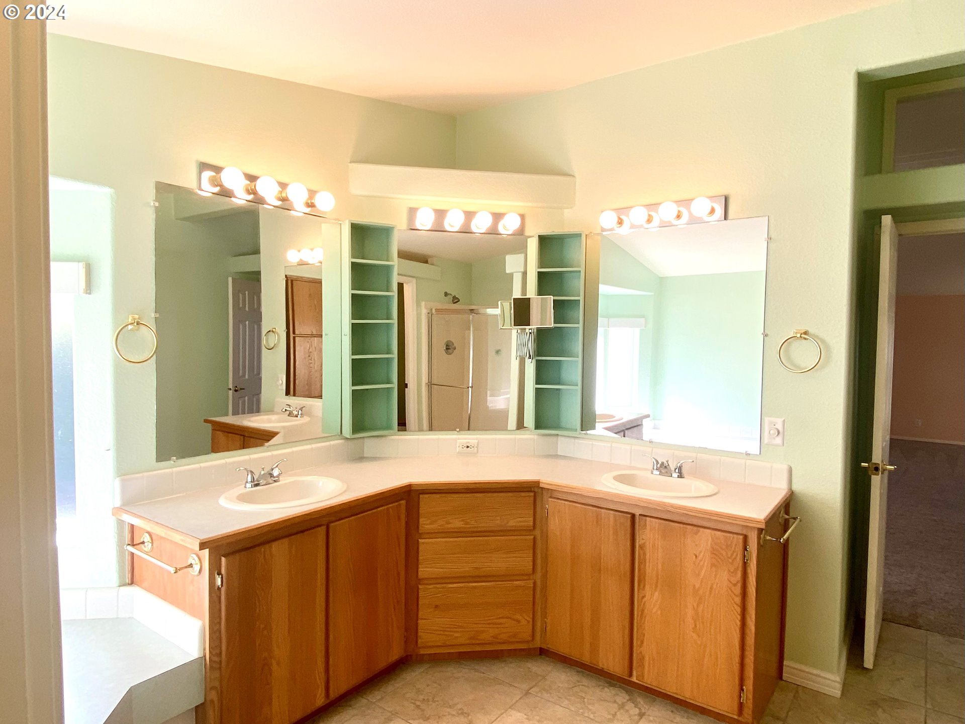 865 Western Way Florence, OR 97439 - Photo 12 of 26 a bathroom with a double vanity sink mirror and