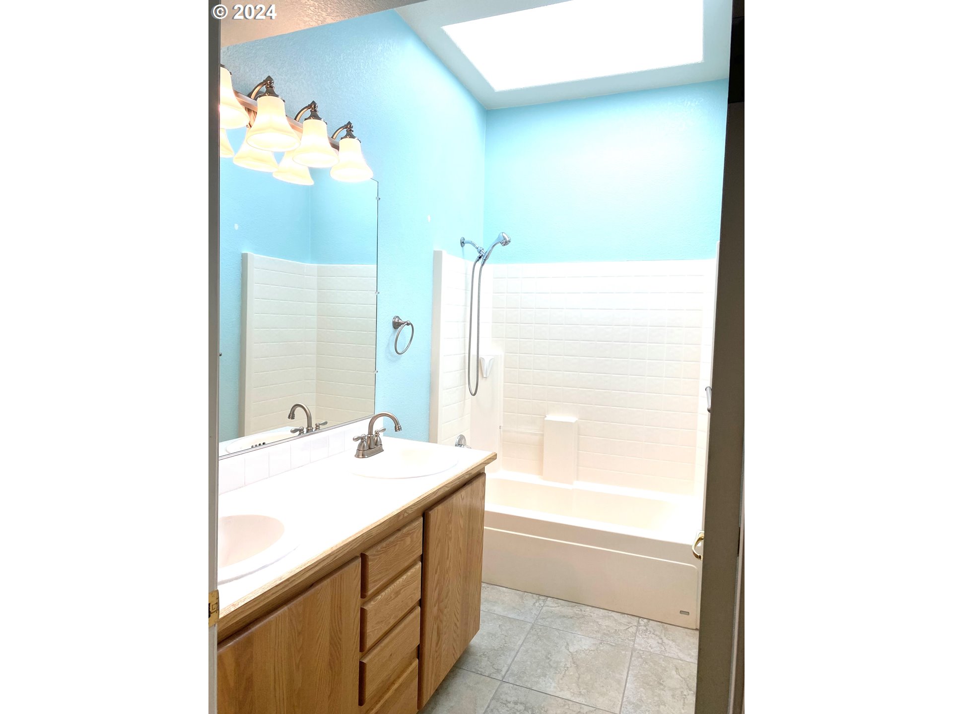 865 Western Way Florence, OR 97439 - Photo 19 of 26 a bathroom with a sink a shower and a mirror