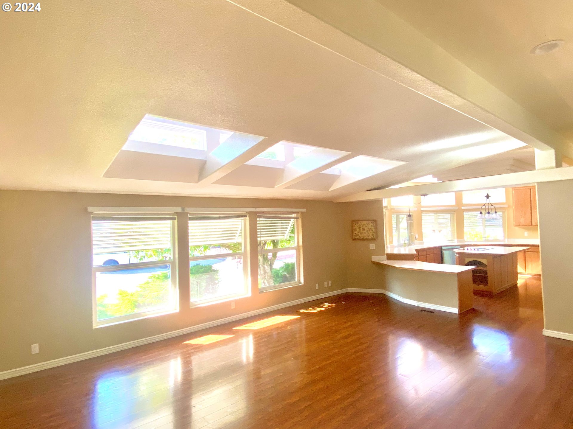 865 Western Way Florence, OR 97439 - Photo 5 of 26 a view of an empty room with wooden floor and a window