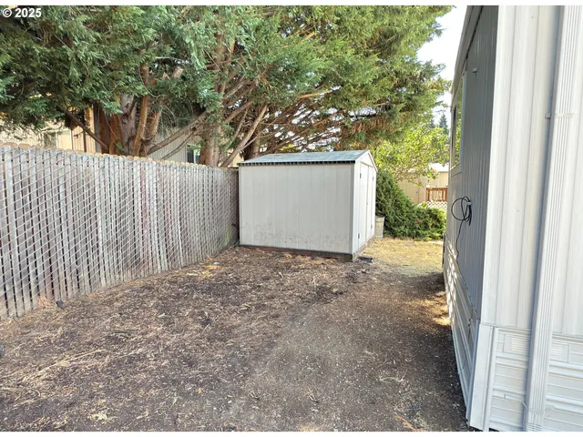 a view of a backyard of the house