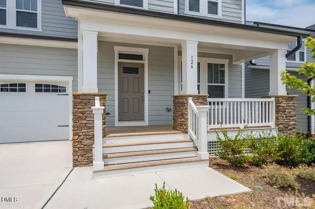 a front view of a house with a porch