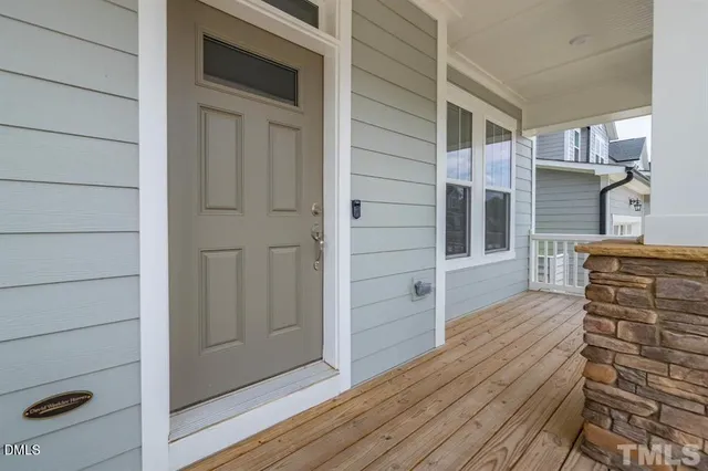 a view of front door and wooden floor