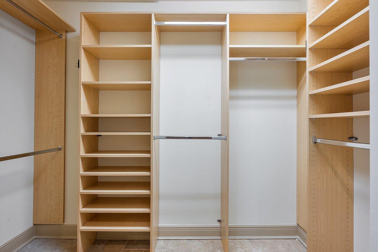 756 Dover Street Boca Raton, FL 33487 - Photo 21 of 29 a view of walk in closet with empty racks