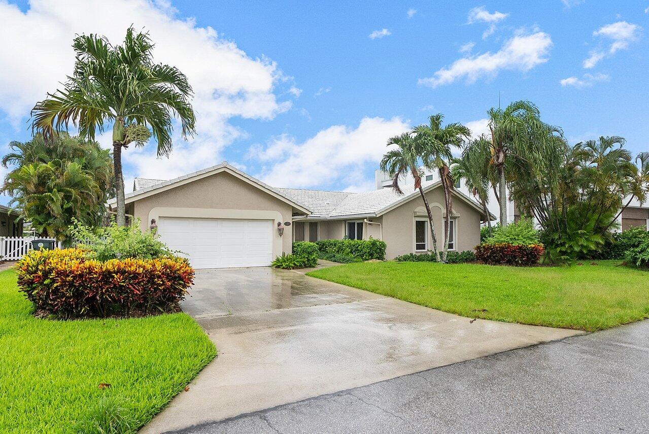 756 Dover Street Boca Raton, FL 33487 - Photo 5 of 29 a front view of house with yard and green space