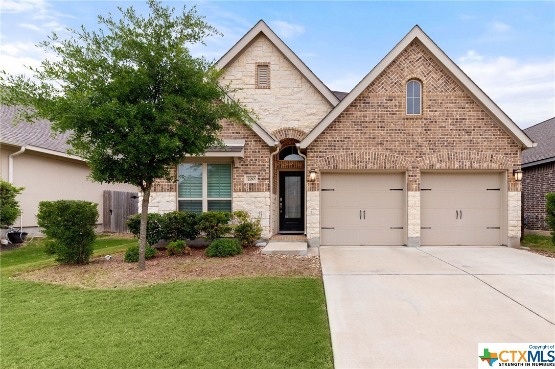 220 Split Rail Drive San Marcos, TX 78666 - Photo 1 of 1 a front view of a house with garden