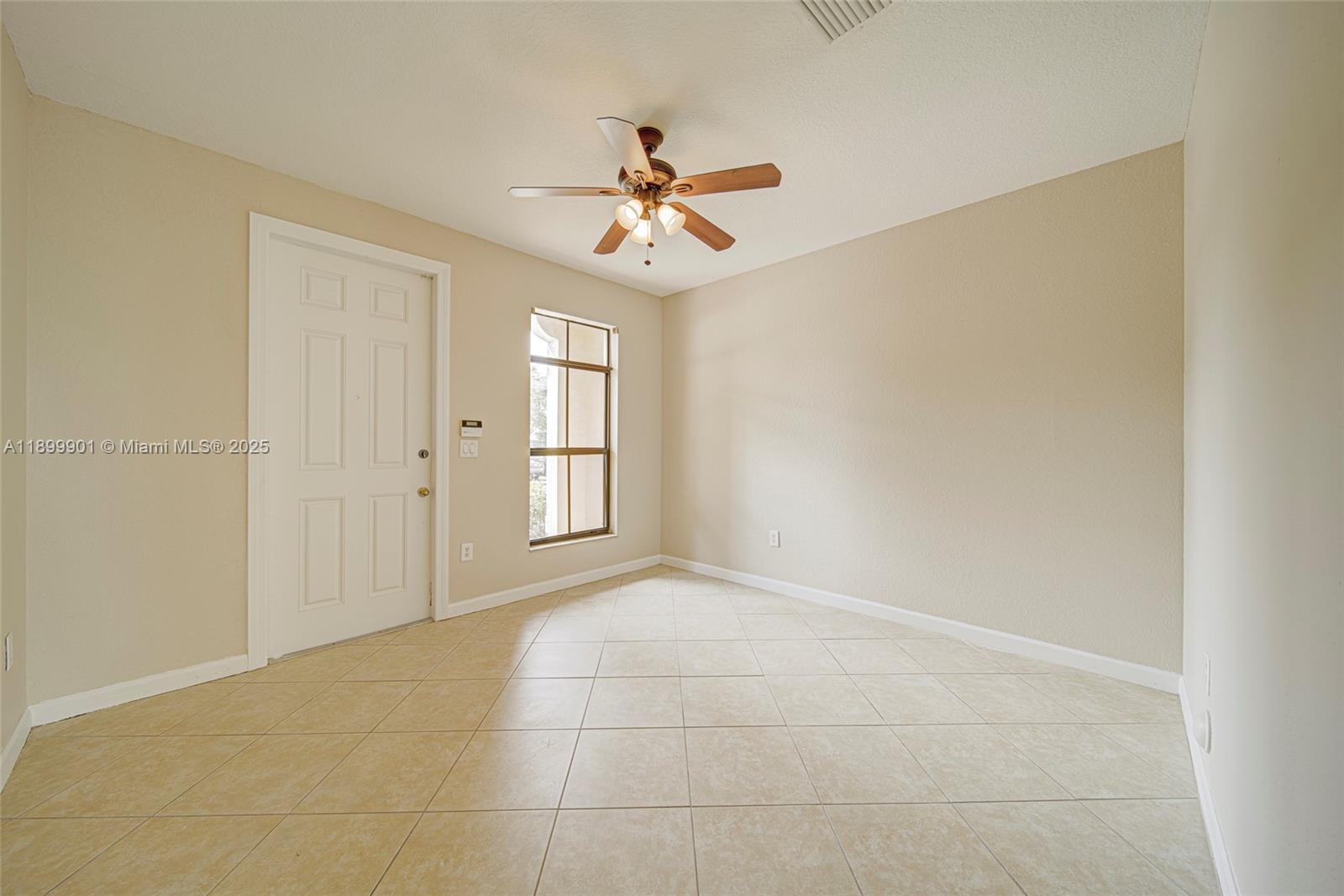 11461 Southwest 236th Lane Homestead, FL 33032 - Photo 15 of 22 wooden floor in an empty room with a window