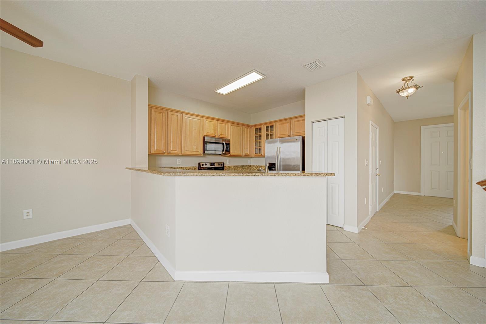 11461 Southwest 236th Lane Homestead, FL 33032 - Photo 18 of 22 a view of kitchen with refrigerator and window