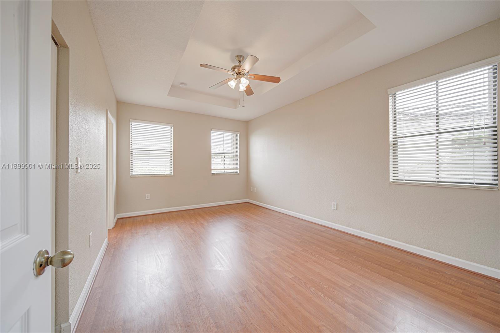 11461 Southwest 236th Lane Homestead, FL 33032 - Photo 4 of 22 wooden floor in an empty room with a window