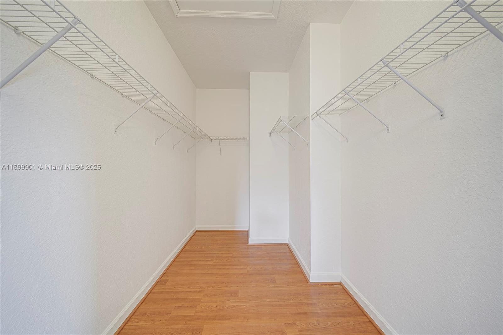 11461 Southwest 236th Lane Homestead, FL 33032 - Photo 5 of 22 a view of a hallway with wooden floor