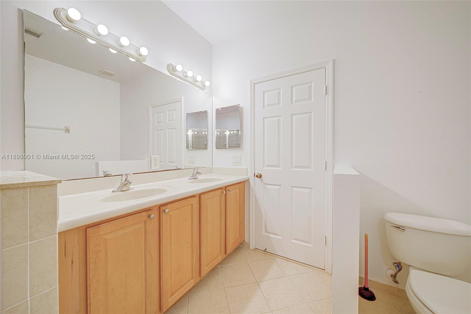 11461 Southwest 236th Lane Homestead, FL 33032 - Photo 6 of 22 a bathroom with a sink a toilet and shower