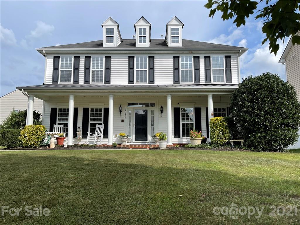 7026 Meyer Road, Unit 384 Fort Mill, SC 29715 - Photo 1 of 29 a front view of a house with a garden