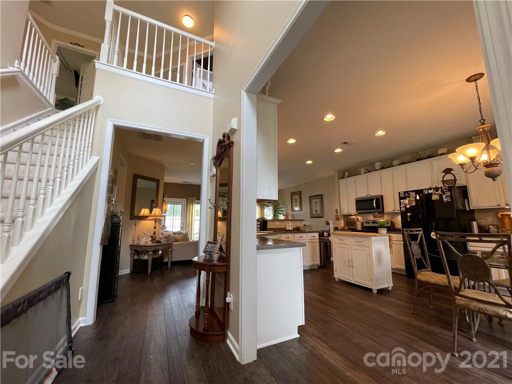 7026 Meyer Road, Unit 384 Fort Mill, SC 29715 - Photo 4 of 29 a view of a living room kitchen with furniture and wooden floor