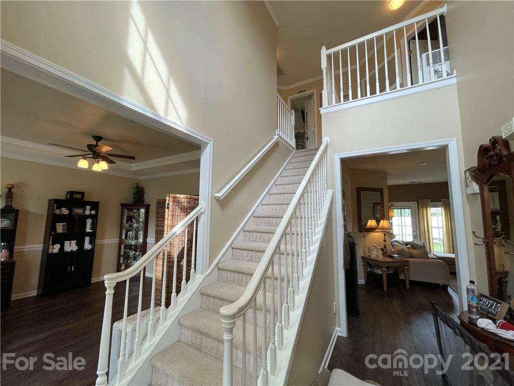 7026 Meyer Road, Unit 384 Fort Mill, SC 29715 - Photo 5 of 29 a view of a livingroom with furniture and staircase