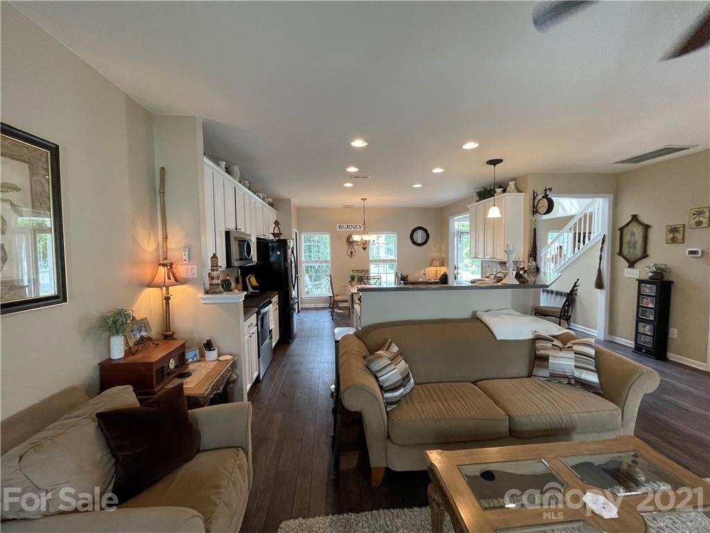 7026 Meyer Road, Unit 384 Fort Mill, SC 29715 - Photo 7 of 29 a living room with furniture and a wooden floor