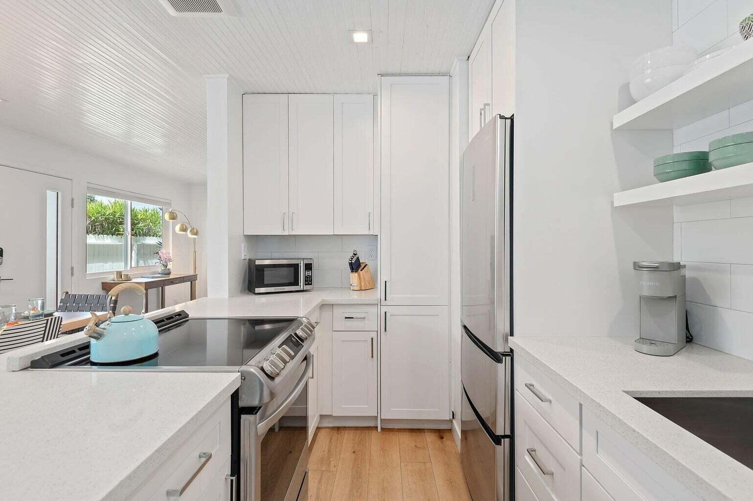 160 Ash Avenue, Unit 3 Carpinteria, CA 93013 - Photo 3 of 11 a kitchen with a sink a stove and refrigerator