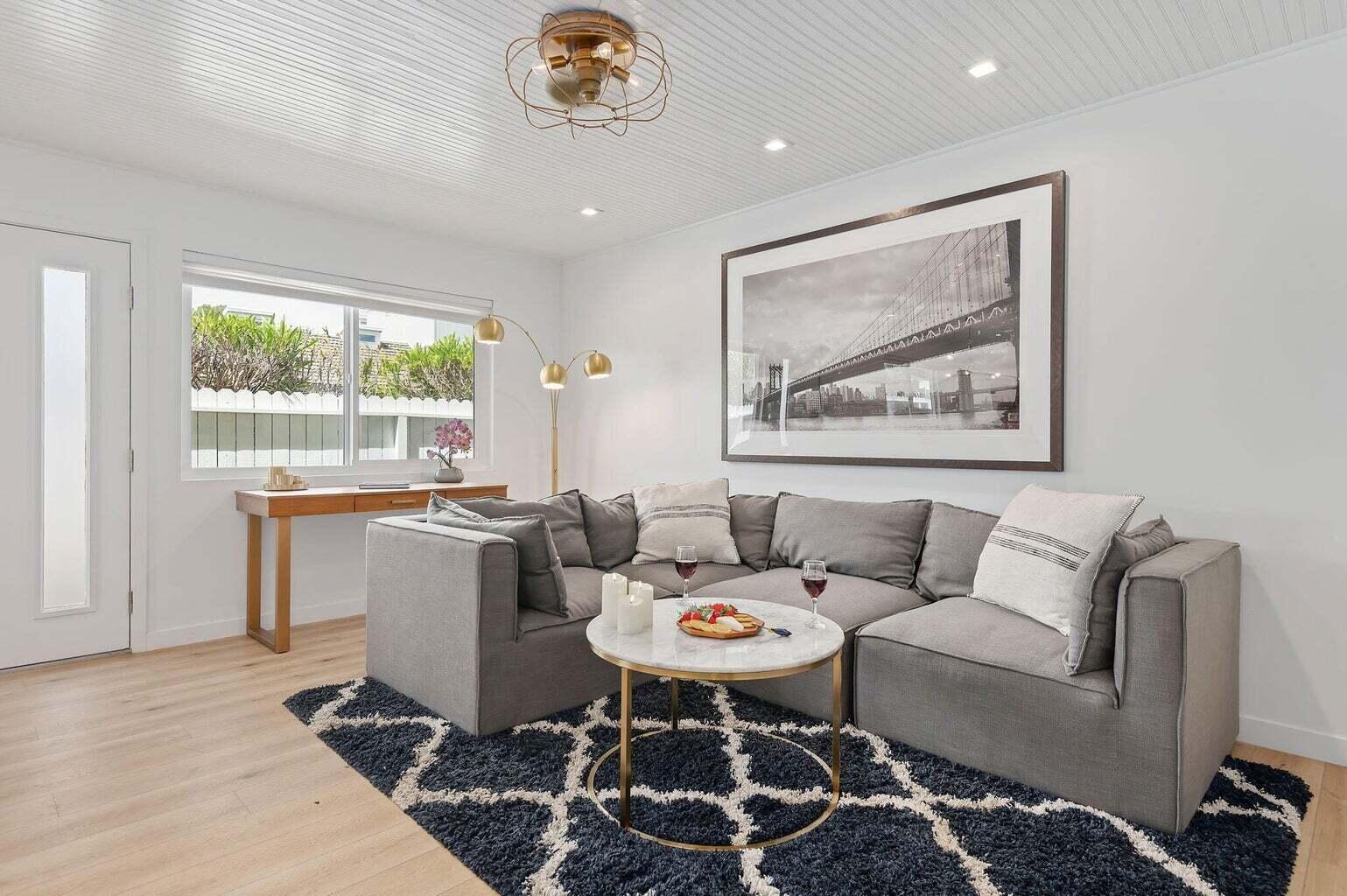 160 Ash Avenue, Unit 3 Carpinteria, CA 93013 - Photo 5 of 11 a living room with a couch and a table