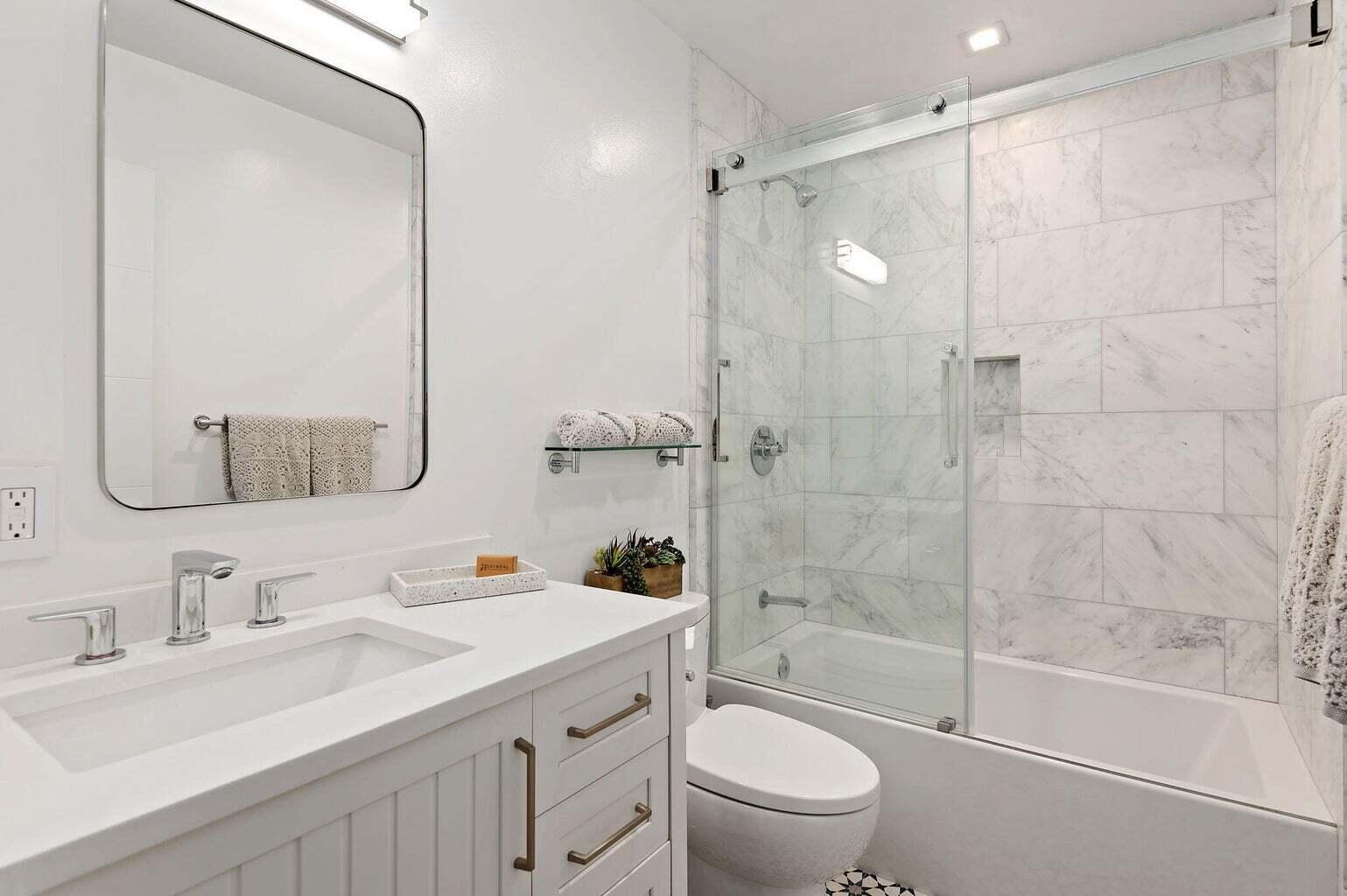 160 Ash Avenue, Unit 3 Carpinteria, CA 93013 - Photo 7 of 11 a bathroom with a sink toilet tub and shower