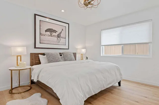 a bedroom with bed and window