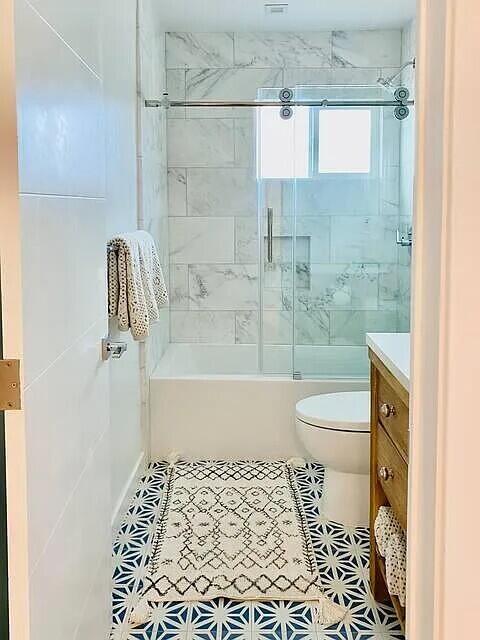 160 Ash Avenue, Unit 3 Carpinteria, CA 93013 - Photo 9 of 11 a bathroom with a shower and a toilet