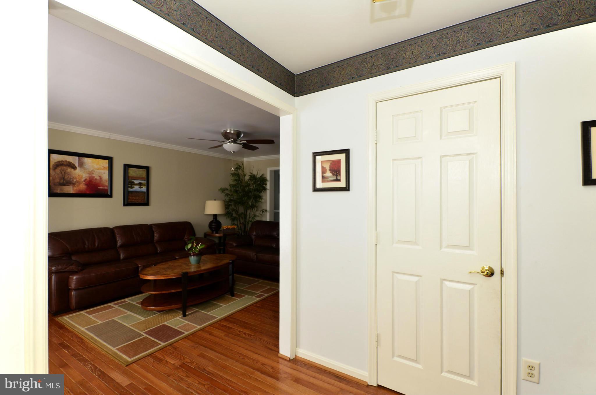 4462 Silver Teal Road Baltimore, MD 21236 - Photo 2 of 30 a living room with furniture and a rug