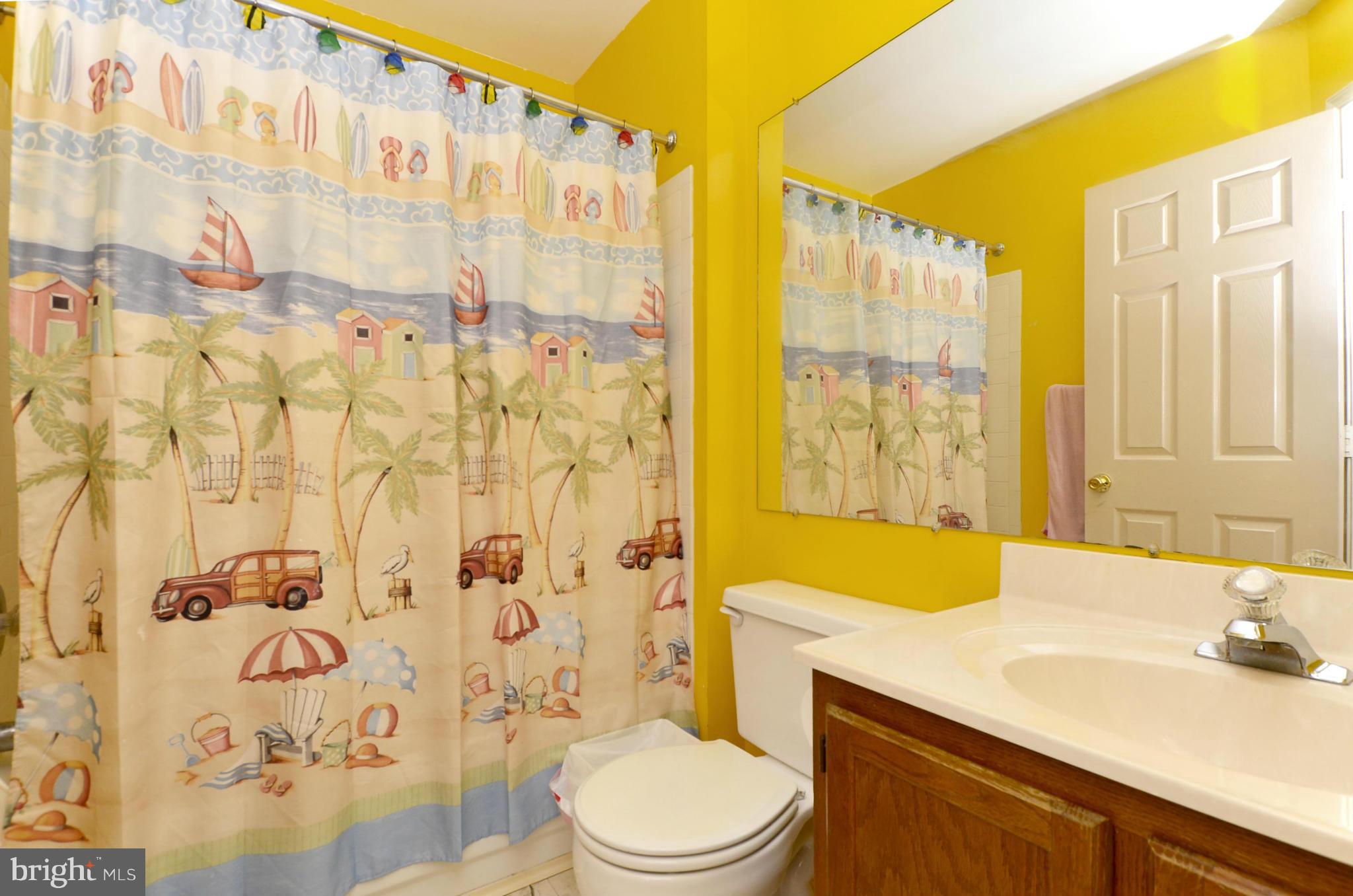 4462 Silver Teal Road Baltimore, MD 21236 - Photo 13 of 30 a bathroom with a sink toilet vanity and shower