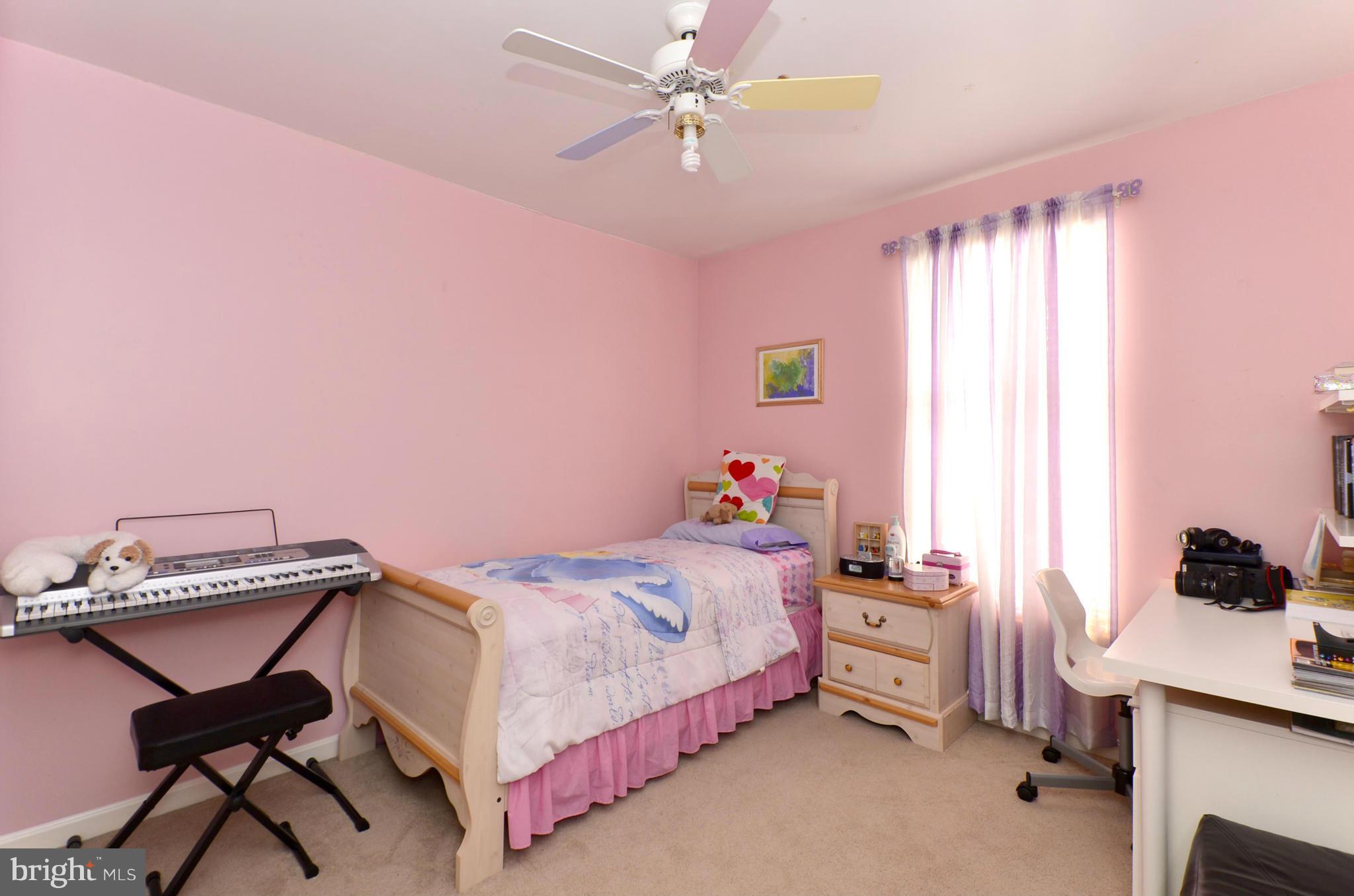 4462 Silver Teal Road Baltimore, MD 21236 - Photo 17 of 30 a bedroom with a bed and a window